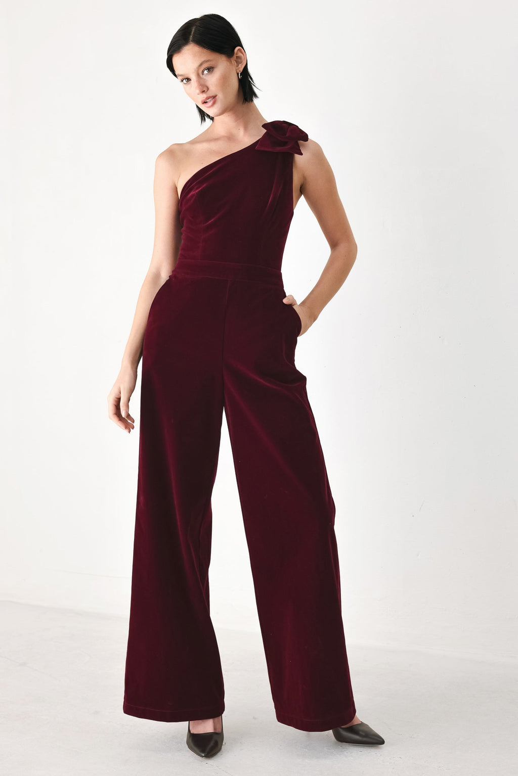 BERRY AFTER DARK VELVET BOW ONE-SHOULDER JUMPSUIT